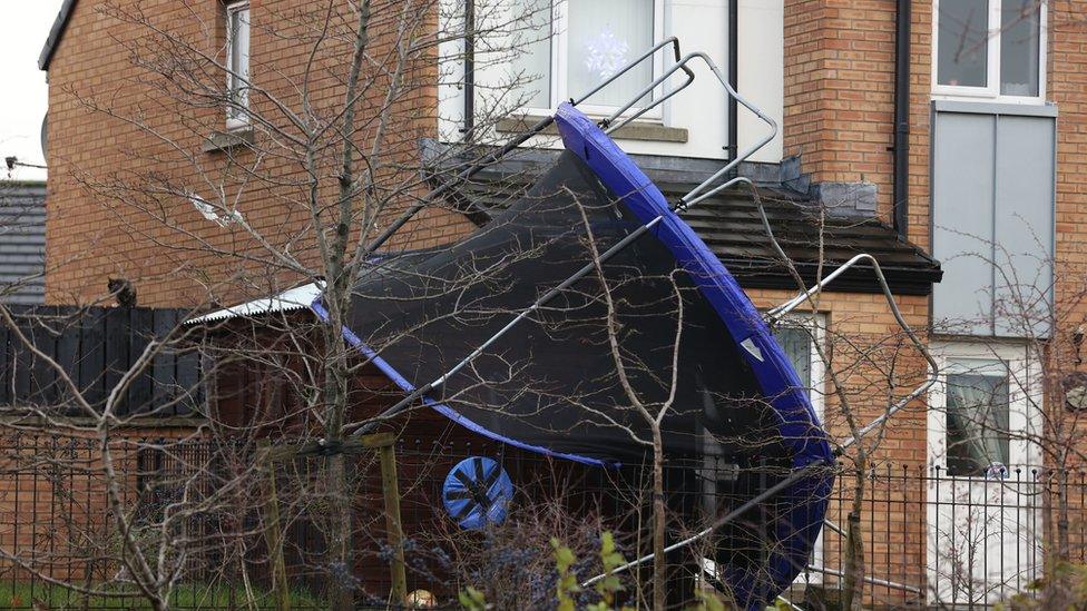 An overturned trampoline at a house in Clon Elagh, Derry, as Storm Barra hits the UK and Ireland with disruptive winds, heavy rain and snow