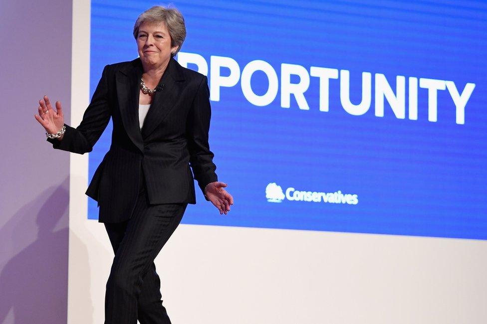 Theresa May dancing