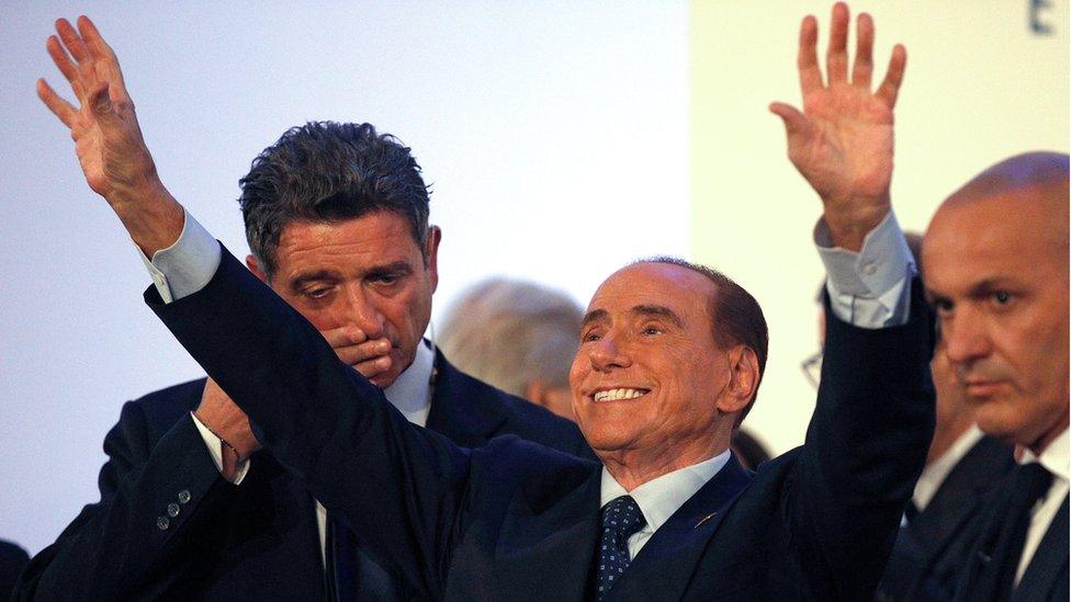 Forza Italia party leader Silvio Berlusconi waves as he leaves at the end of a rally in Catania, Italy, November 2, 2017.