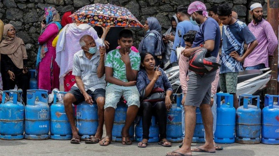 People queue up to buy domestic cooking gas cylinders near a selling depot amid a cooking gas shortage in Colombo, Sri Lanka, 02 June 2022.