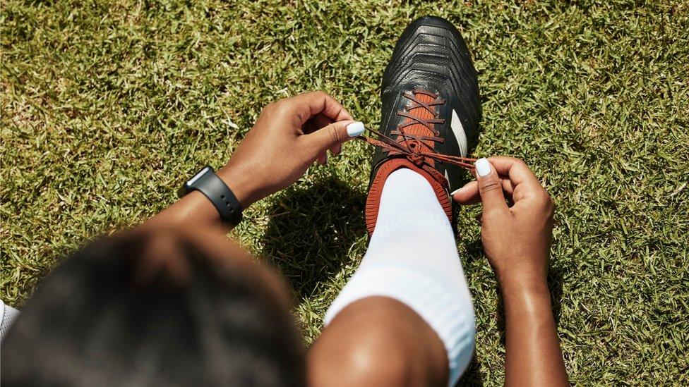 woman-tying-bootlaces.