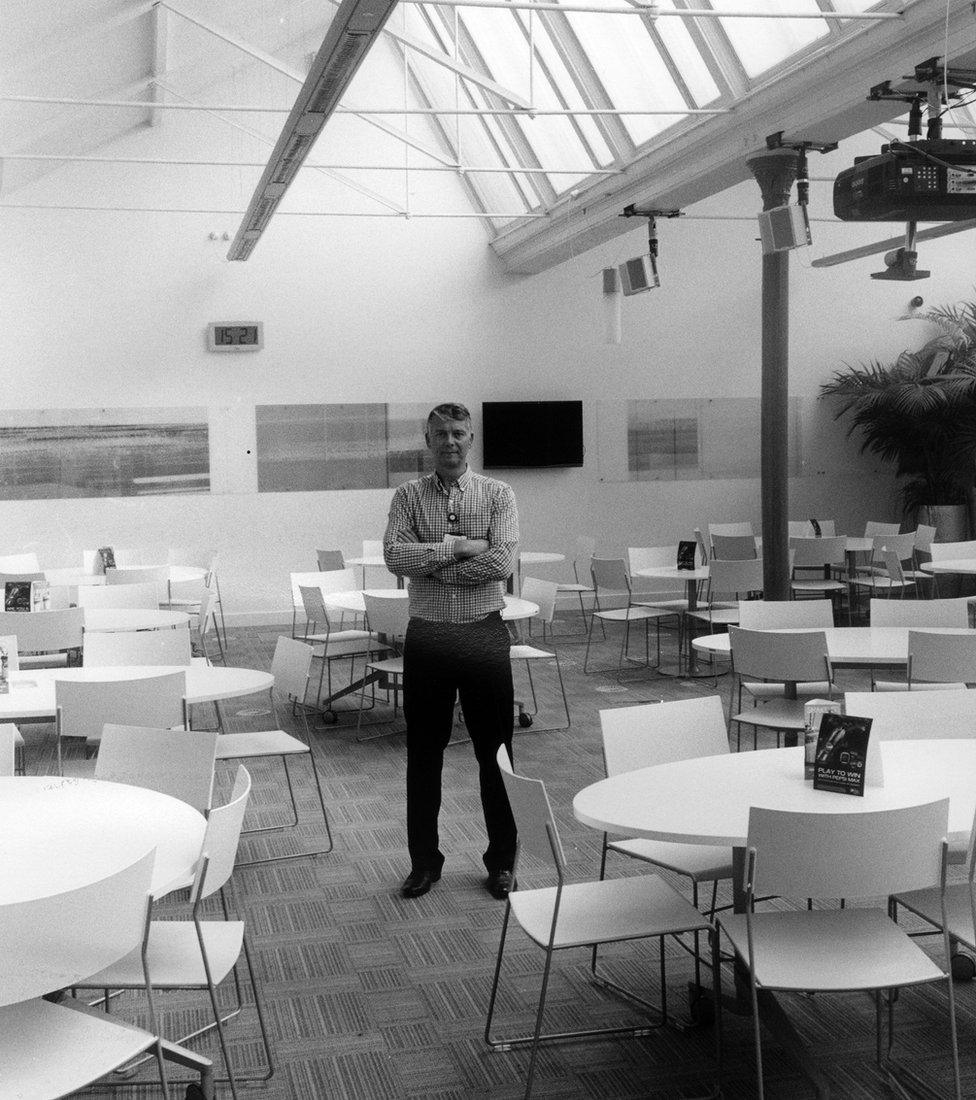 Man standing in a canteen