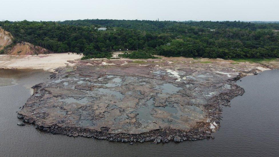 Amazon riverbank ancient stone carvings