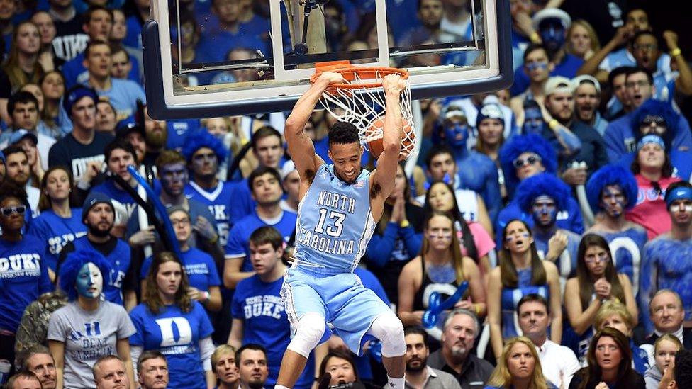 University of North Carolina player J.P. Tokoto does a reverse slam during the Duke game against the University of North Carolina February 18, 2015 at Duke University in Durham, North Carolina. T