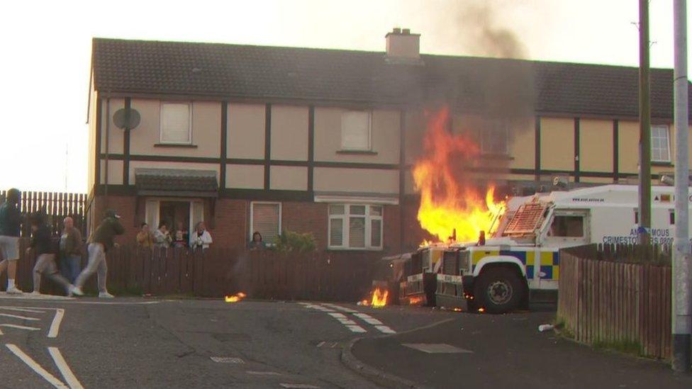 Police being attacked with petrol bombs in the Creggan