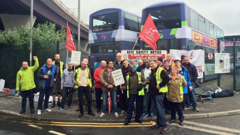 Union members outside a bus depot