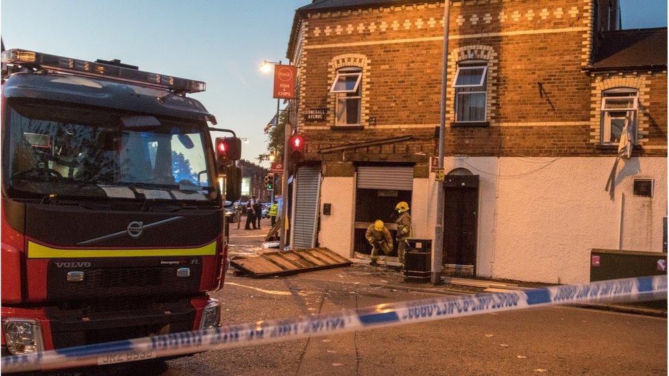 Fire fighters standing outside fast food outlet