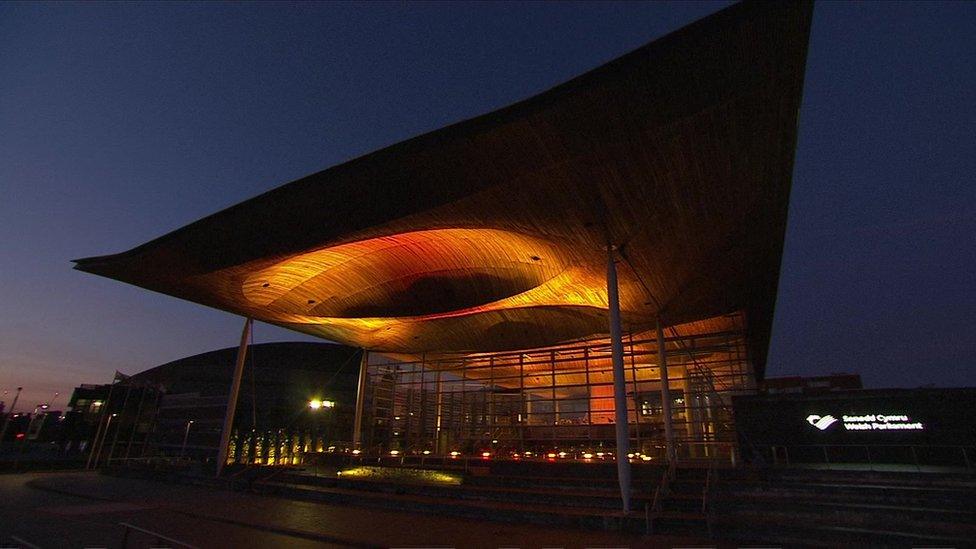 The Senedd lit up in yellow