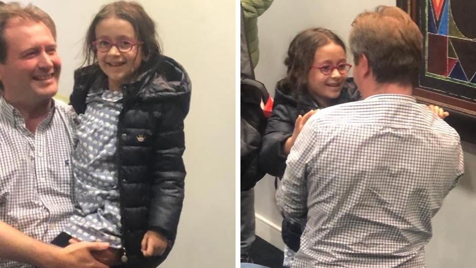 Richard Ratcliffe embraces his daughter, Gabriella, after she landed back in the UK