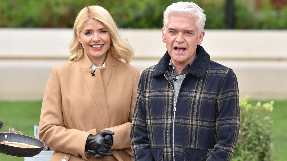 Holly Willoughby and Phillip Schofield with Ainsley Harriott attempt a world record for tossing pancakes during the This Morning show. on February 25, 2020 in London, England