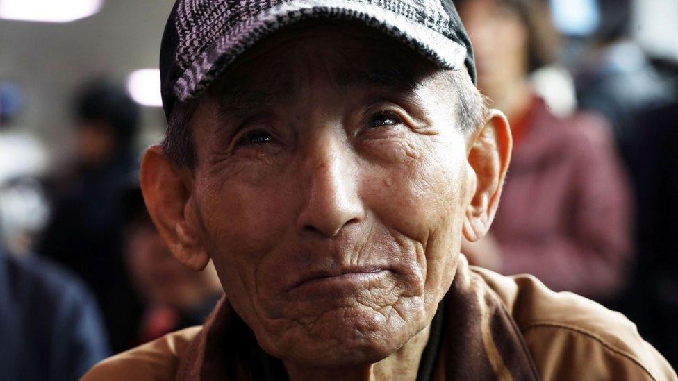 A South Korean man weeps as he watches the April peace summit