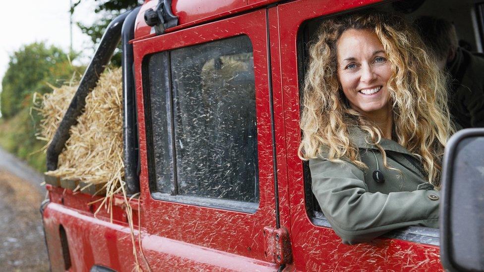 Woman driving Jeep