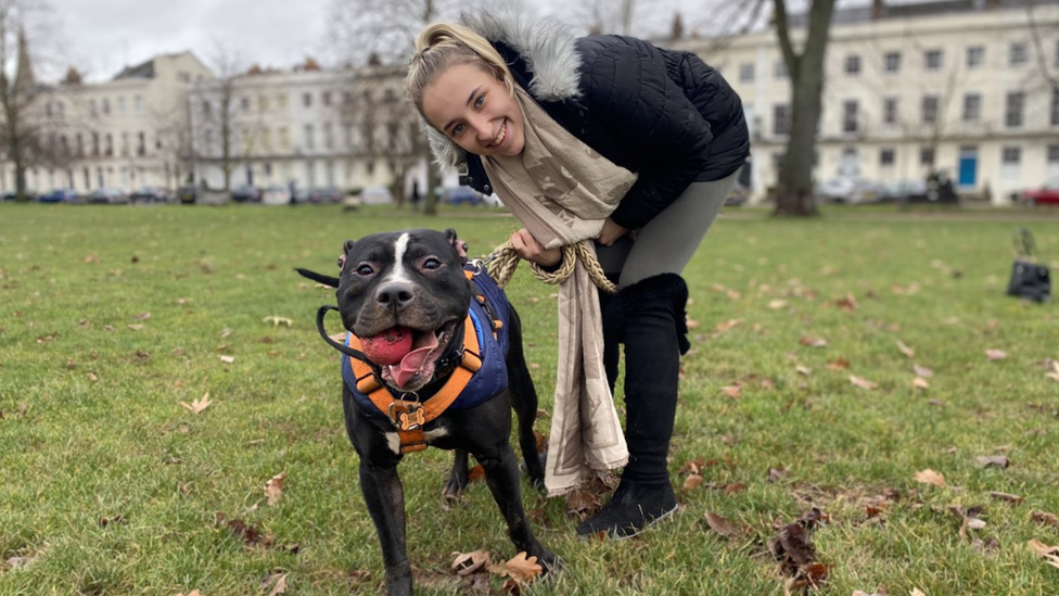 Elise Philcox in the park with her dog on a lead