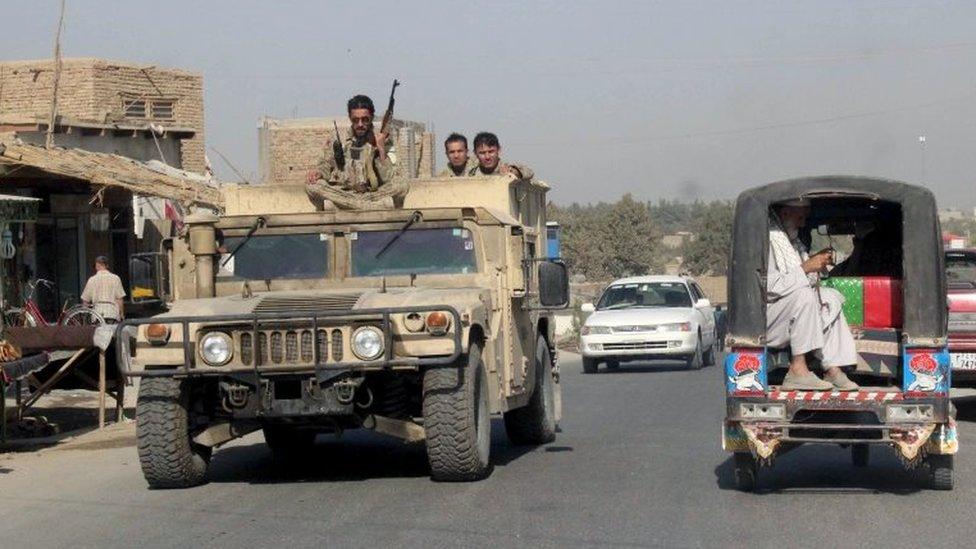 Afghan security forces travel on an armoured vehicle in Kunduz Province, Afghanistan (28 Sept 2015)