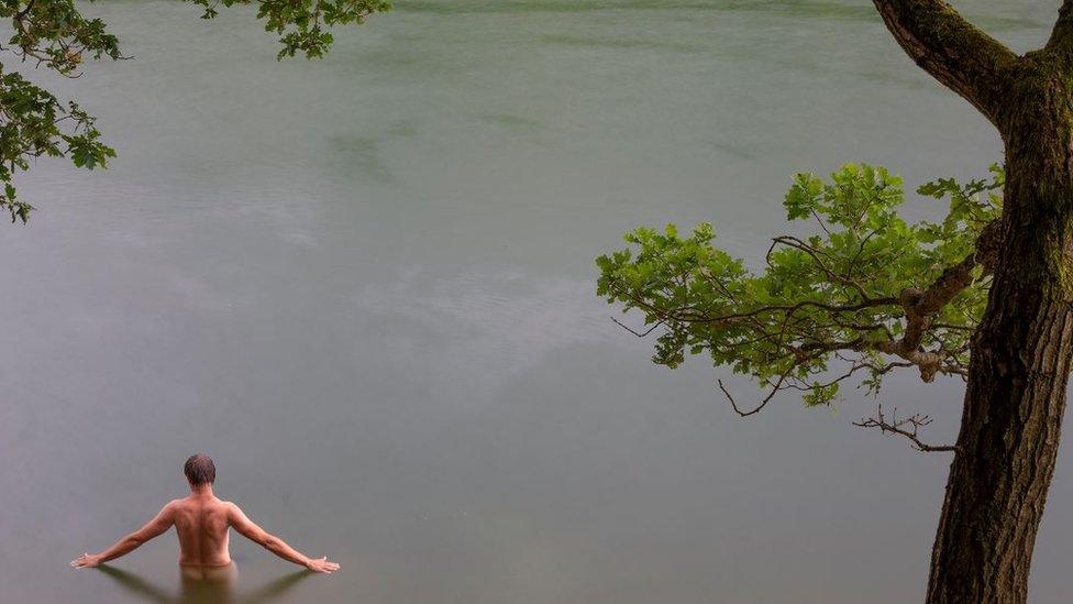 Michal in a lake in Olpe, western Germany