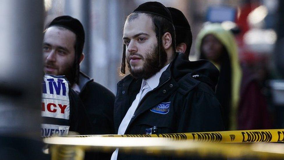 Jewish community members near the shop