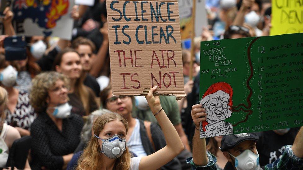 People protest during a climate emergency demonstration called "New South Wales is Burning, Sydney is Choking" organised by Uni Students for Climate Justice in Sydney, Australia, 11 December 2019.