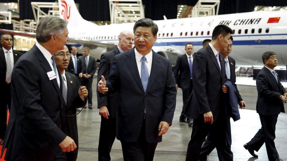 Chinese President Xi Jinping tours the Boeing assembly line in Everett, Washington