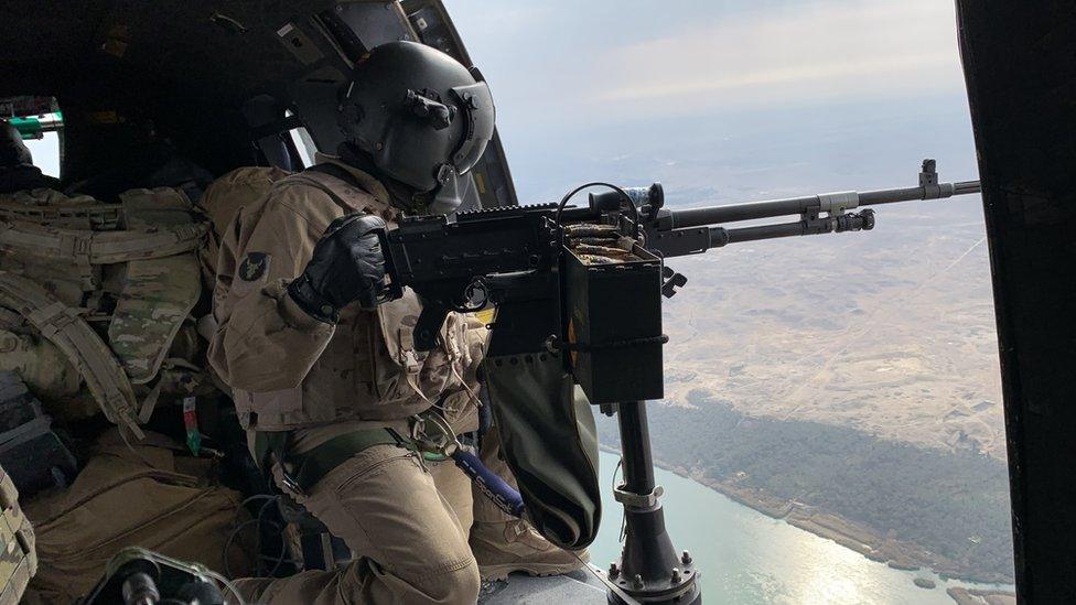 Coalition forces in a helicopter