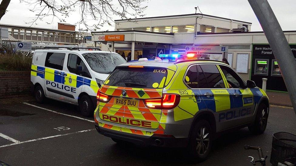 Police vehicles outside Forest Hill station