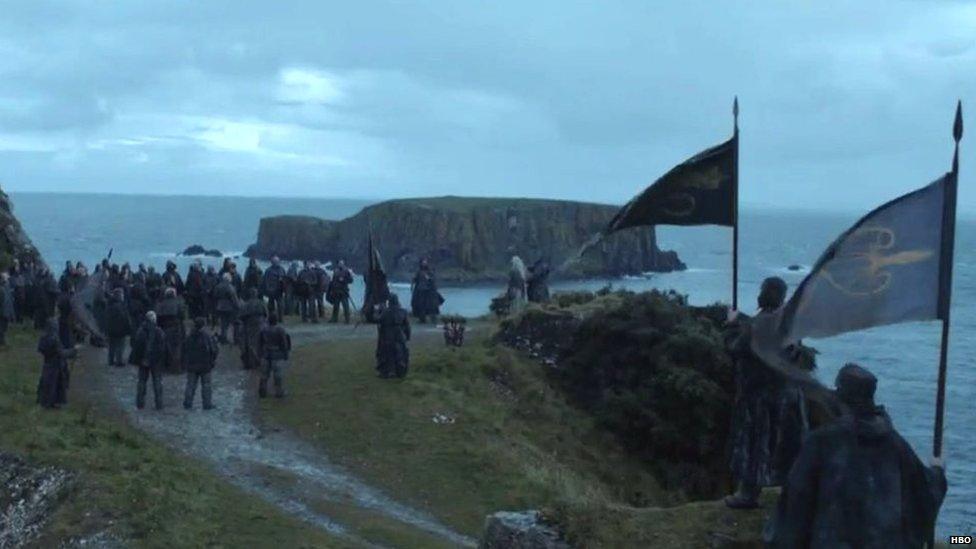 A crowd from the House of Greyjoy surround someone in the Game of Thrones series six trailer.