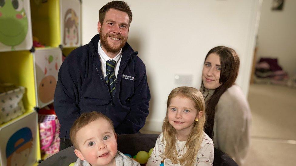 Louis Brown and his partner Chloe Smith with their children