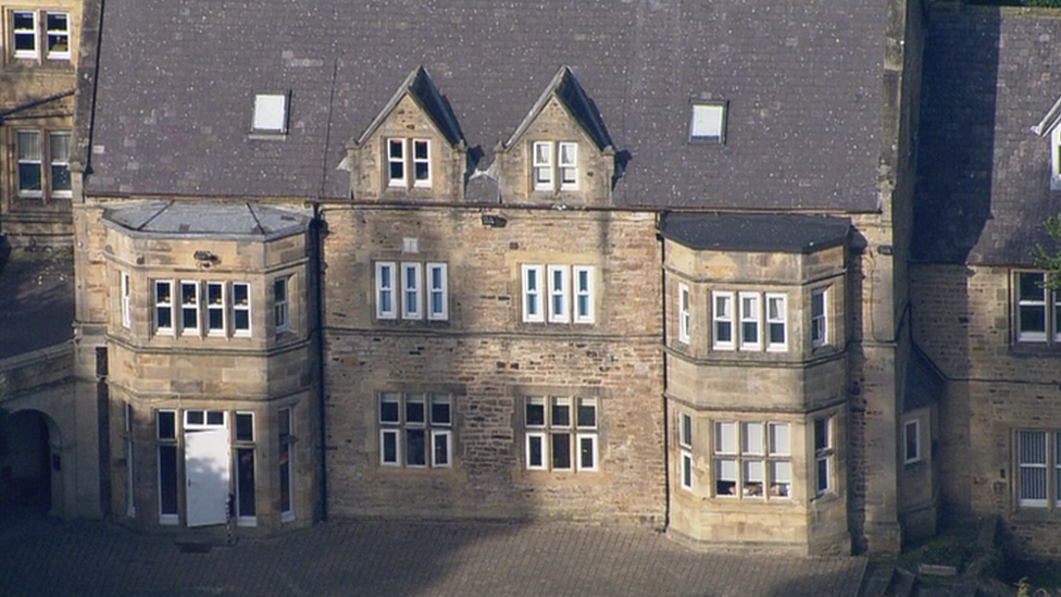 Aerial view of Whorlton hall. It is a large two storey manor house type building with dormer windows in the roof.