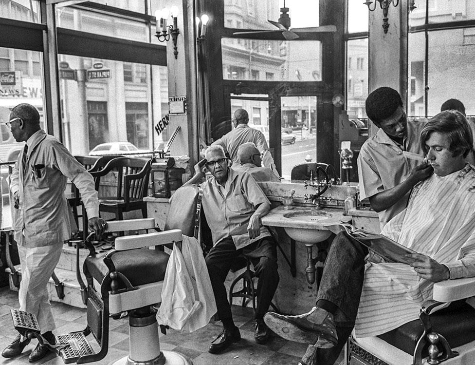 An all-white barber shop run by all-black barbers in downtown Atlanta, 1970