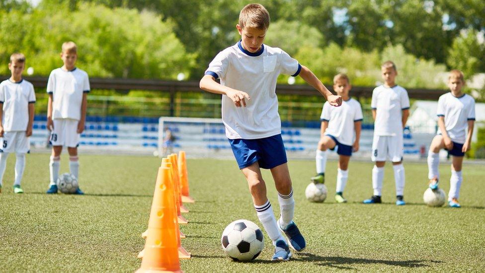 Boys playing football