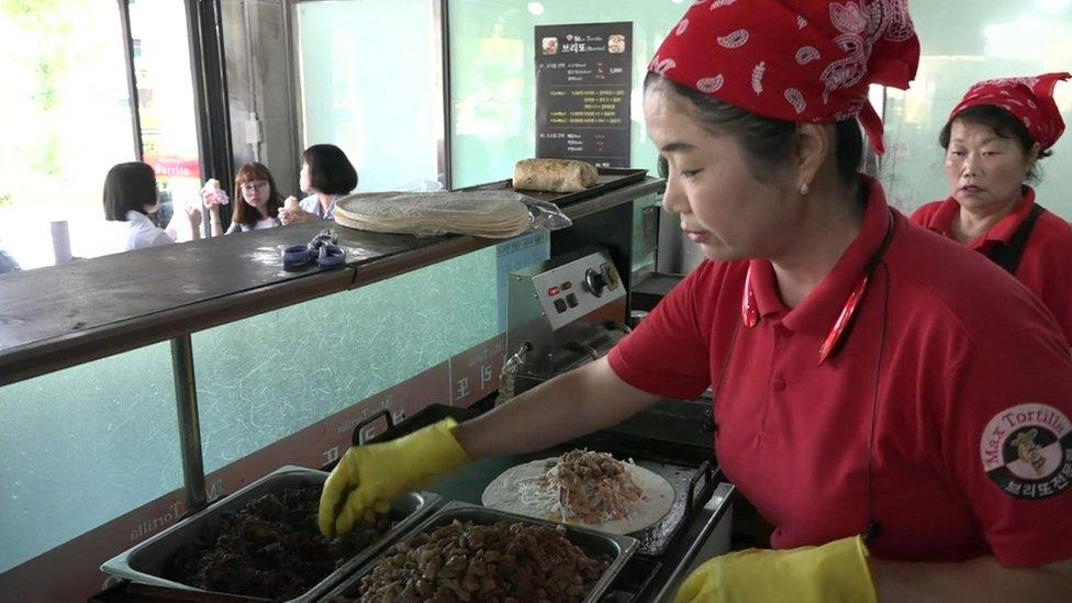 Lee Yung-hee at work in her burrito restaurant