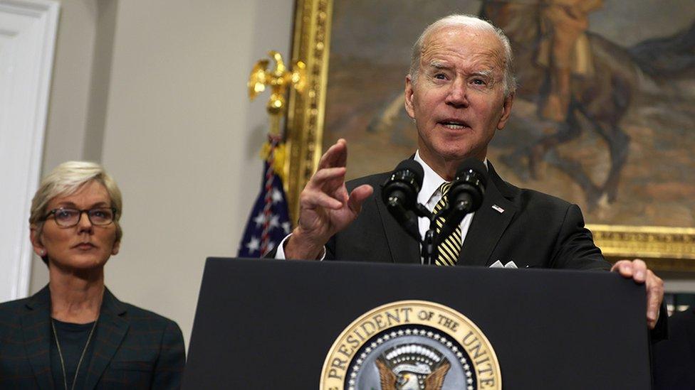 Joe Biden announces the release of 15 million barrels of oil from the US strategic reserve, Secretary of Energy Jennifer Granholm stands in the background, October 2022.