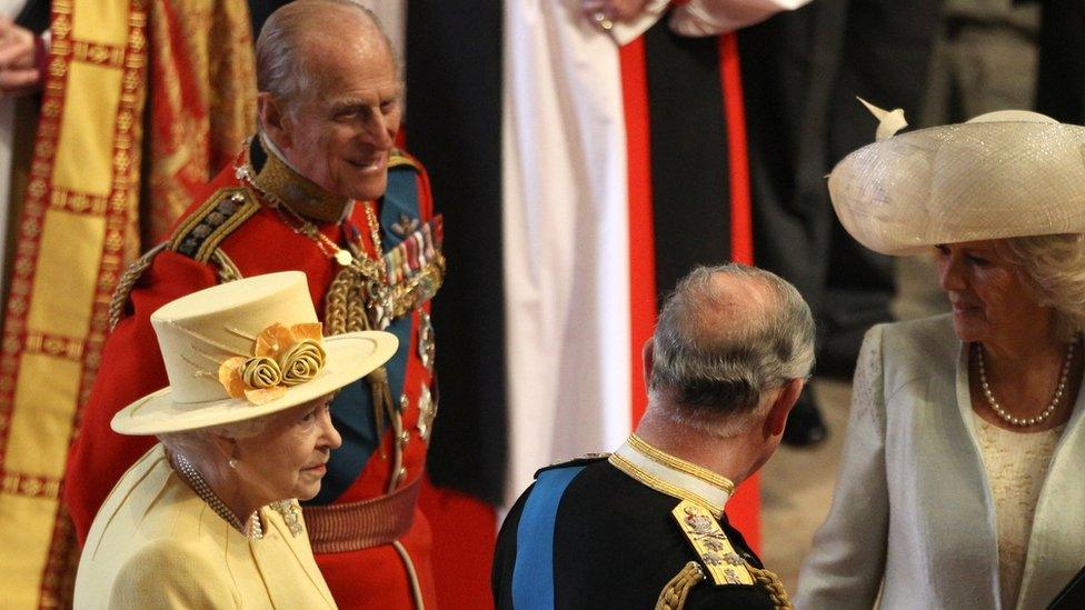 The Duke of Edinburgh speaks to the Prince of Wales on the day of Prince William's wedding to Catherine Middleton in 2011