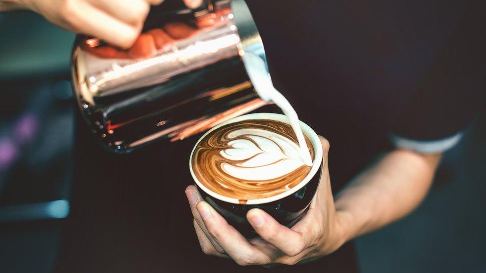 man making a coffee