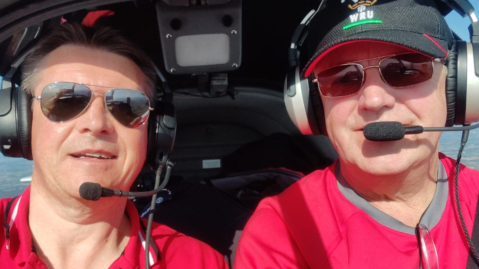 Gavin Johns (left) and Dave Pitman (right) in the cockpit of their light aircraft