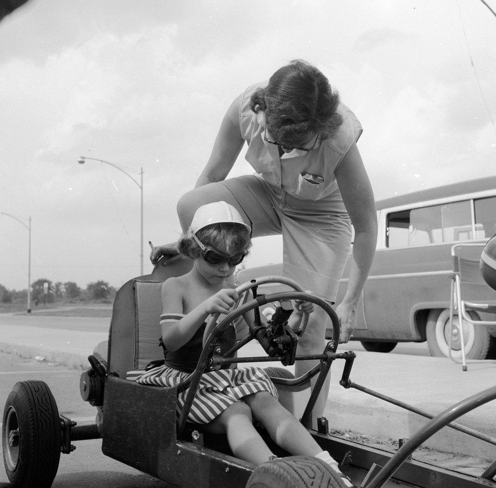 boy and mum with car