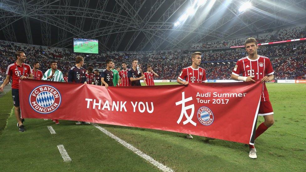 Bayern Munich players with a thank you banner in China