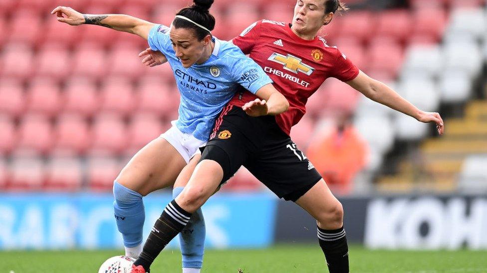 Lucy Bronze challenged by Hayley Ladd during Manchester United Vs Manchester City football match