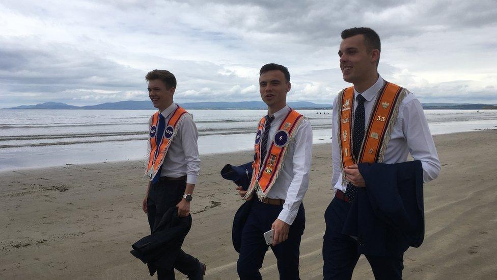 ORANGEMEN ON A BEACH