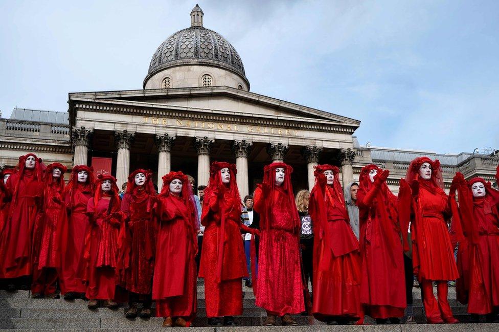 Climate activists protest on the steps of the National Gallery in Trafalgar Square during the third day of climate change demonstrations by the Extinction Rebellion group, in central London on 9 October 2019.