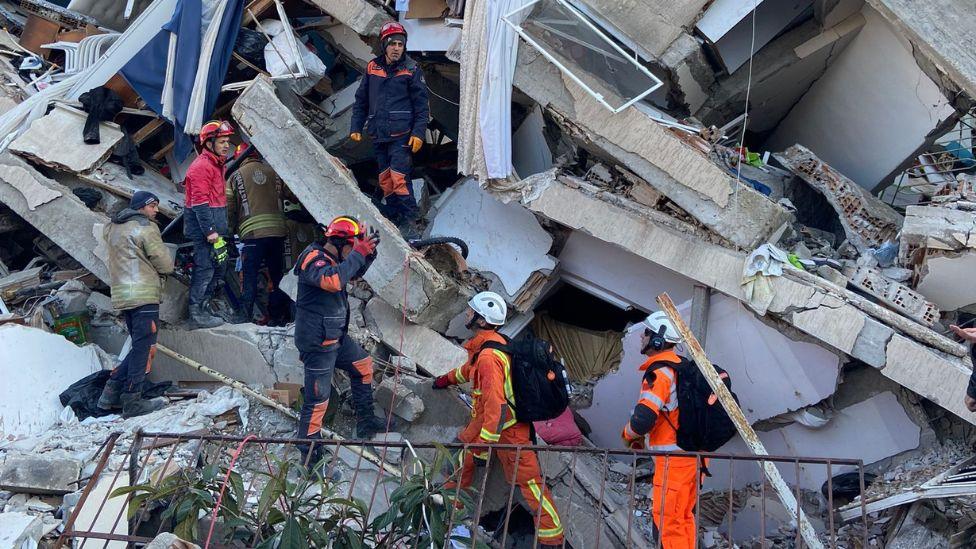 Rescue team at work on rubble