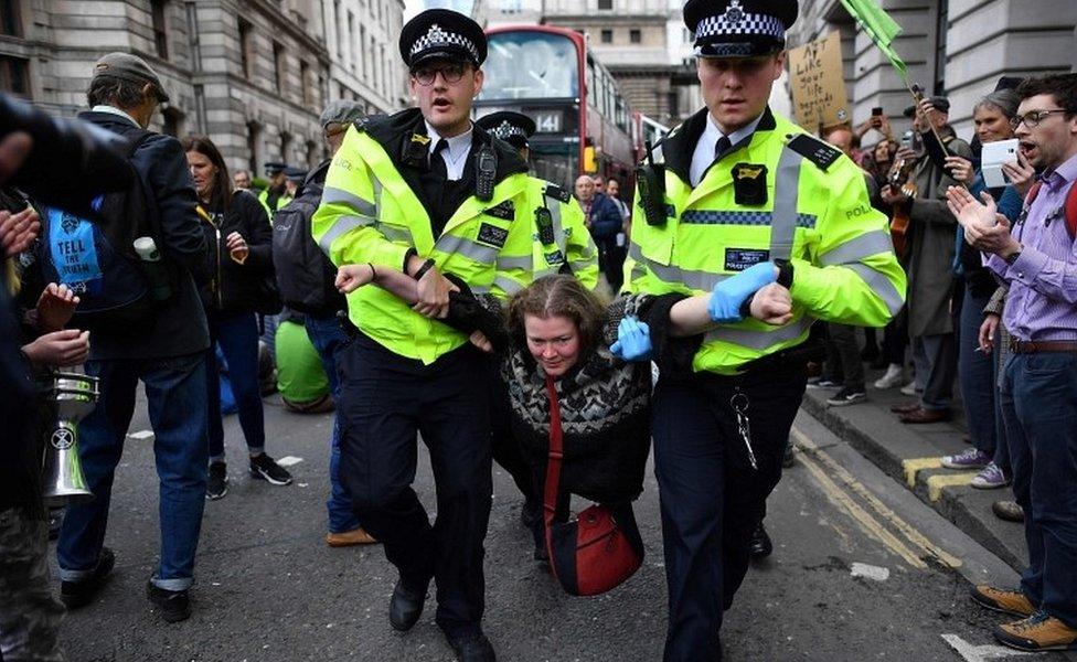 Protester removed from roadblock around bank