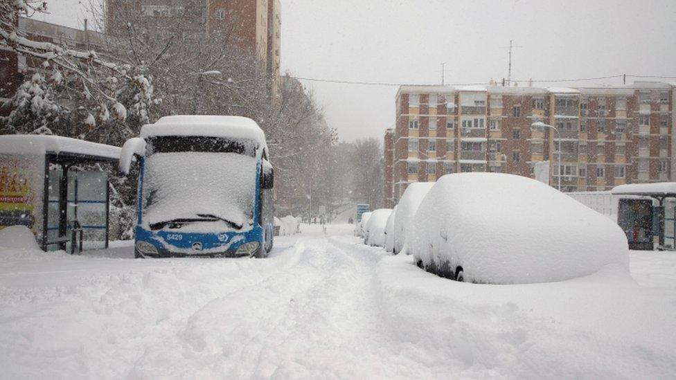 bus covered in snow