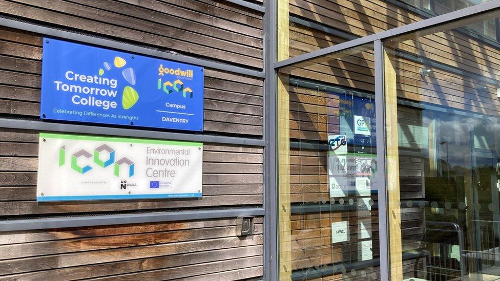 Signs showing "Creative Tomorrow College" and "iCon Innovation Centre" outside revolving door.