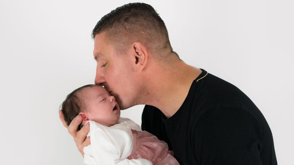 Alan Barefoot and his baby daughter