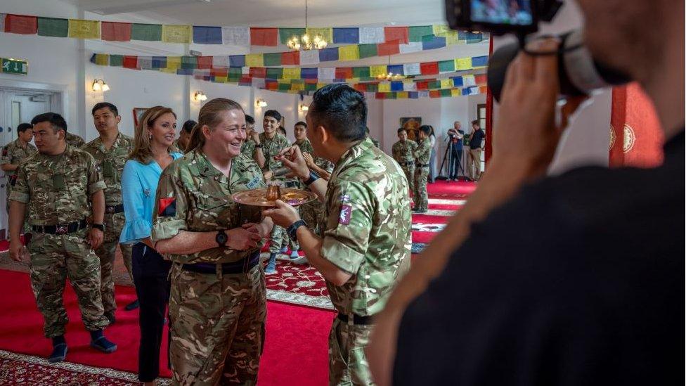 Army chaplain Any Walters being filmed for an episode of Songs of Praise