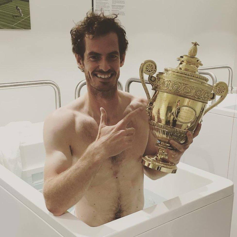 Andy Murray in ice bath with Wimbledon trophy