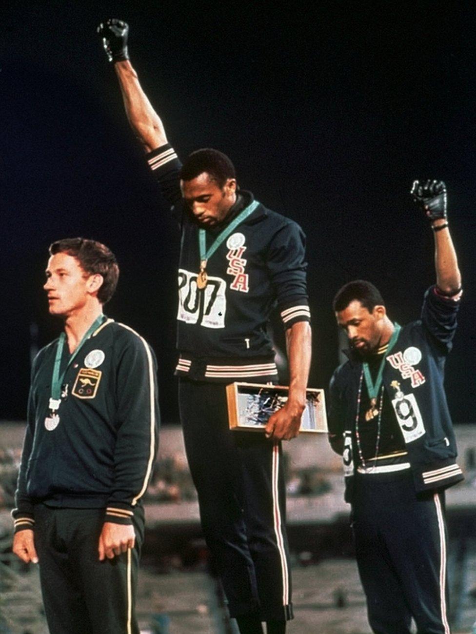 Tommie Smith, centre, and John Carlos during their protest at the 1968 Olympics