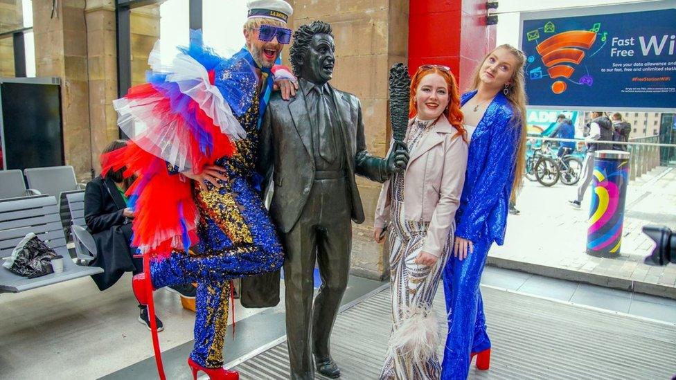 Fans pose at Liverpool Lime Street station