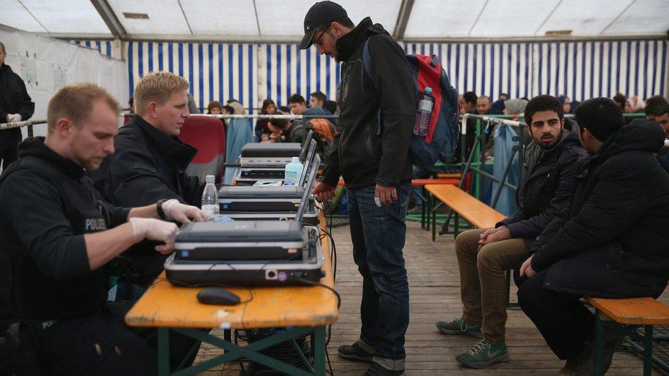 German police process migrants at a reception tent at railway station in Passau. 17 October 2015