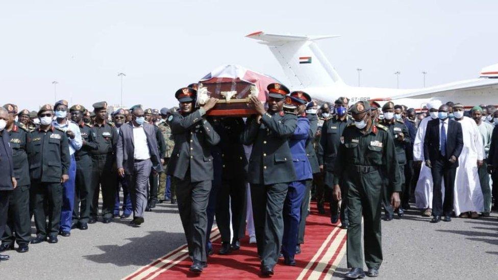 Coffin of Sudan's Defence Minister Gamal Omer, 59, died in Juba, the capital of neighboring South Sudan, is being carried during the official funeral ceremony at Khartoum International Airport on March 25, 2020 in Khartoum, Sudan.